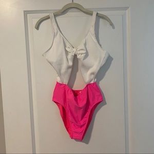 Pink and white one-piece swimsuit